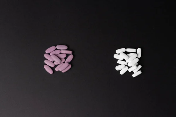 Two Piles Pills Lie Black Background White Purple Choice Addiction — Stock Photo, Image