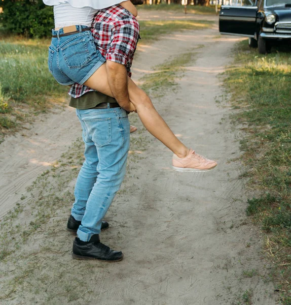 Girl Jumped Guy Back Holds Her Legs Check Shirt Jeans — Stock Photo, Image
