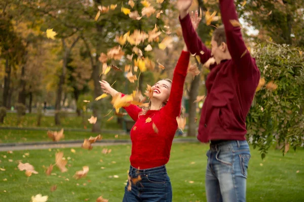 Couple Throws Yellow Leaves Maple Fooling Autumn Date Laughing Having — Stock Photo, Image