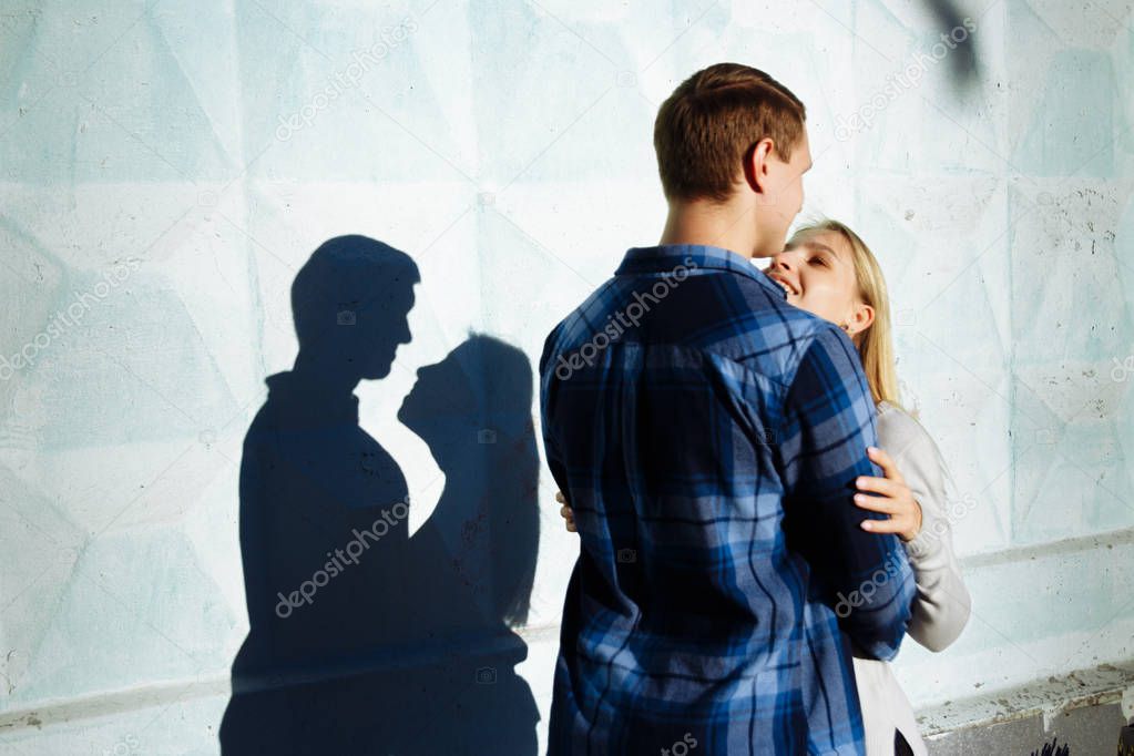 the shadow of a couple, between a man and a woman, kiss embracing. profile, silhouette.Couple Kissing Shadow