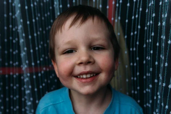 Naughty boy smiling at camera, portrait of a child — Stock Photo, Image