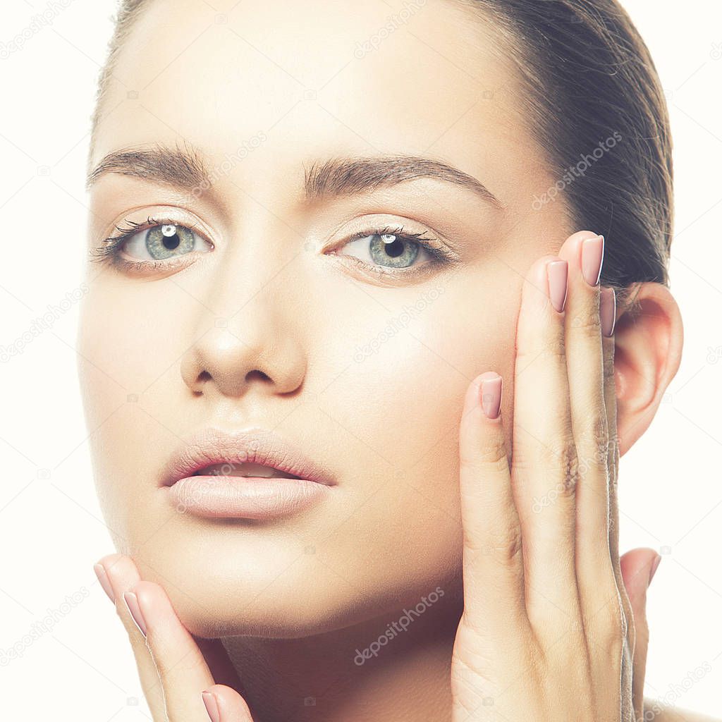 Portrait of young woman with natural makeup on white background