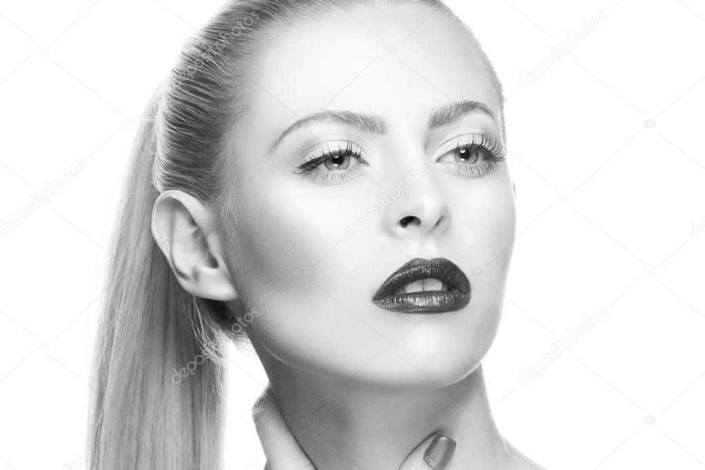 Portrait of woman with dark lips and nail polish