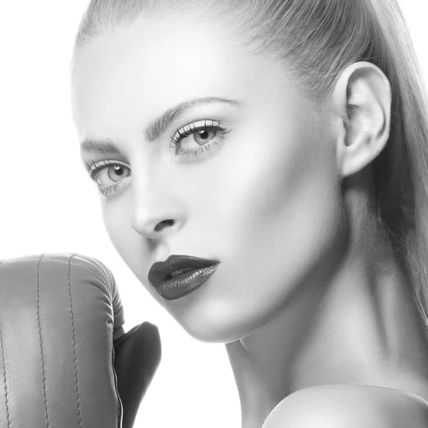 Fashion model with dark lips and boxing-gloves on white background