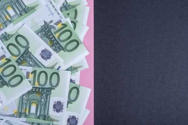 Euro cash on a pink and black background. Euro Money Banknotes. Euro Money. Euro bill. Place for text.