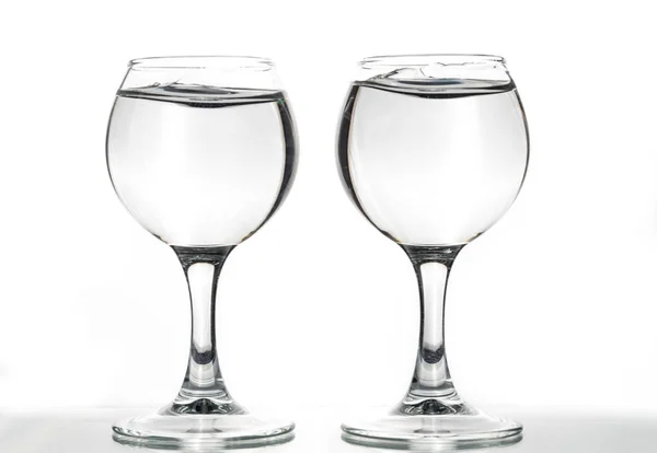 Two Glasses Empty Full Waves Liquid White Background — Stock Photo, Image