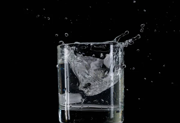 Bounce Splash Piece Ice Thrown Transparent Glass Water Black Background — Stock Photo, Image