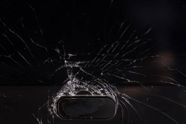 Broken smartphone screen, cracks and shattered glass under various eels