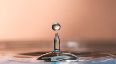 Splashed out and splashed from a falling drop on a colored or black background