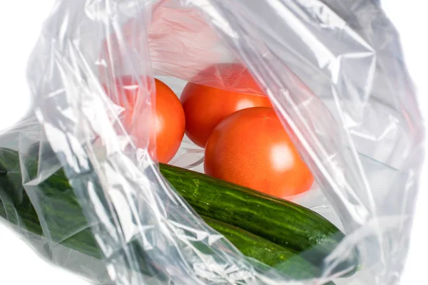 Tomato and cucumber in a transparent packaging bag