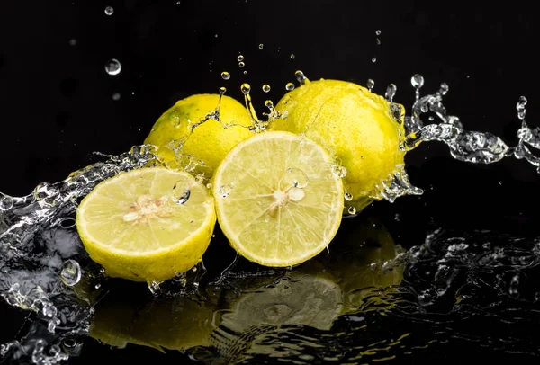 Whole Lime Halves Close Slices Water Splashes Stock Photo