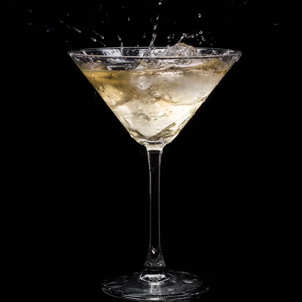 Martini Glass Vermouth Ice Falls Splashes Drops Black Background — Stock Photo, Image