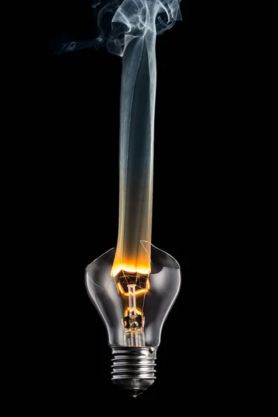 Broken Light Bulb Smoke Burning Spiral Black Background — Stock Photo, Image