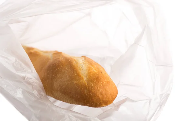 mini baguette long loaf pastries in a transparent bag on a white background