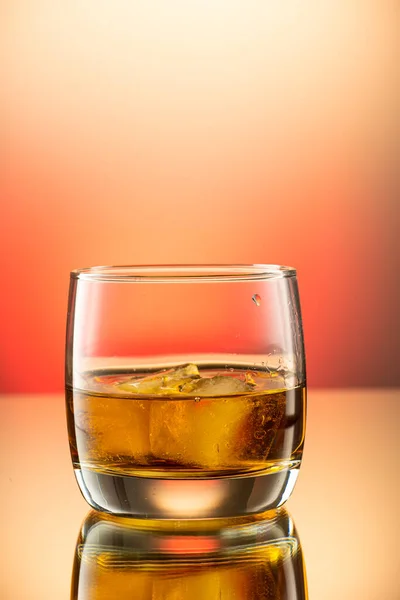 Whiskey with an Ice Ball in a Glass Stock Photo - Image of brandy