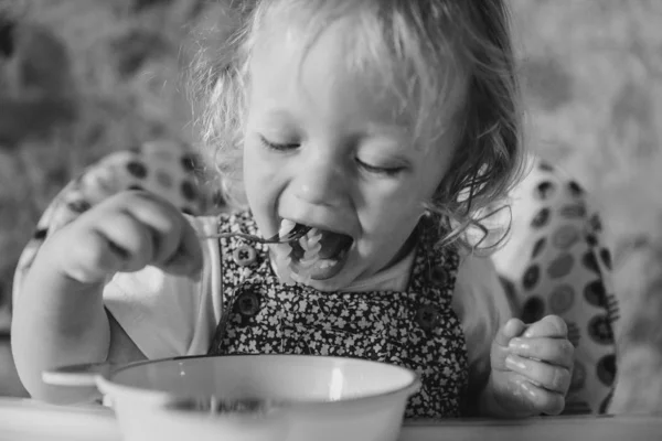 Cute Baby Girl Eating Food Kitchen — Stock Photo, Image