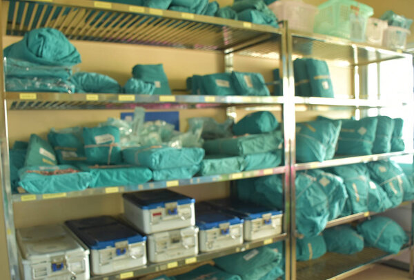 Blurred shelves that there are sterile sets  in clean room of operating floor.