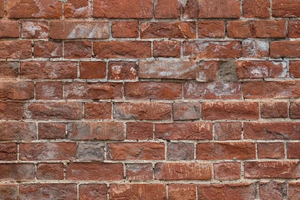 Dokulu arka plan boş kırmızı tuğla duvar. Yakın çekim