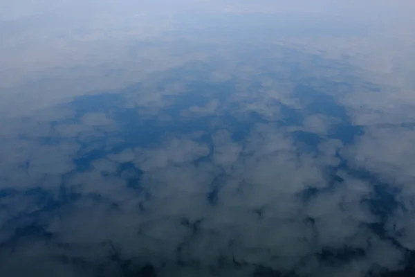 Reflection of the sky in a watery surface, abstraction — Stock Photo, Image