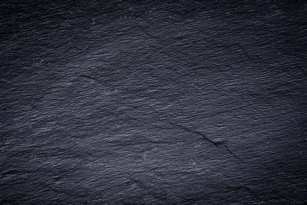 Fondo de pizarra negra gris oscuro o textura de piedra natural . —  Fotos de Stock