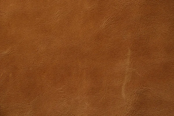 Ljusbrun eller orange äkta läder textur bakgrund, äkta läder — Stockfoto