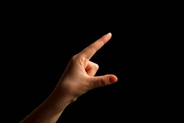 Hand Showing Sign of G Alphabet in American Sign Language (ASL), isolated on black background. Sign language