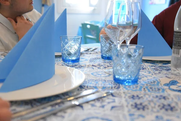 Restaurant table before eat with glasses and plates