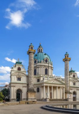Karlskirche  (St. Charles Church) has garnered fame due to its dome and its two flanking columns of bas-reliefs, Vienna, Austria clipart