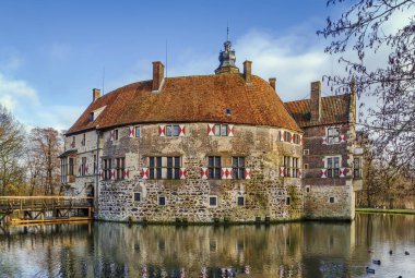 Vischering Castle in Ludinghausen, North Rhine-Westphalia is the most typical moated castle in the Munster region of Germany clipart