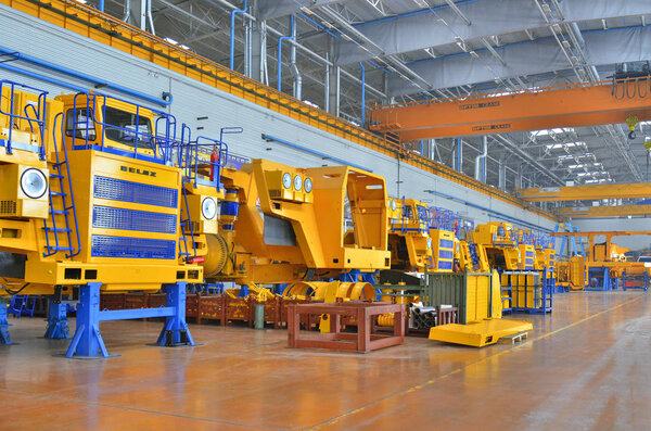 Mining dump truck manufacturing plant. Workshop assembly of large dump trucks.