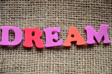 dream word on wood abstract colorful background