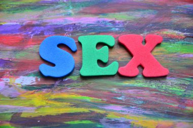 word sex on a abstract colorful paper background