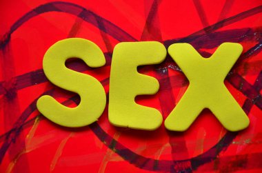 the word sex is written on abstract red background.