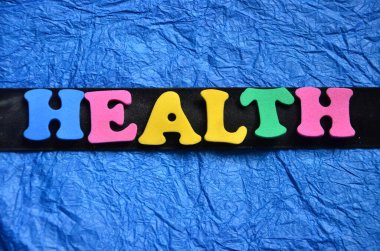 soyut renkli arkaplan üzerine sağlık kelimesi