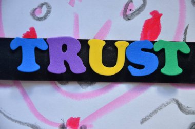 the word trust is on abstract colorful background