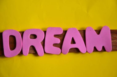 the word dreams on the abstract background.