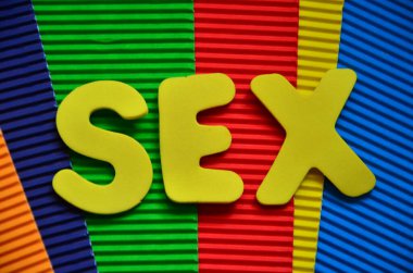 sex word on colorful wooden background