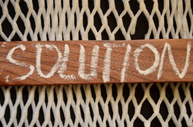 word solution made of wood on the table