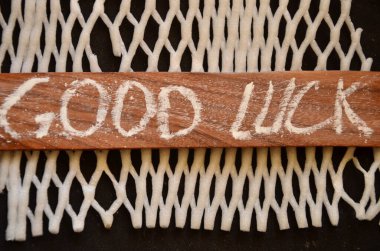 wooden background with a word luck
