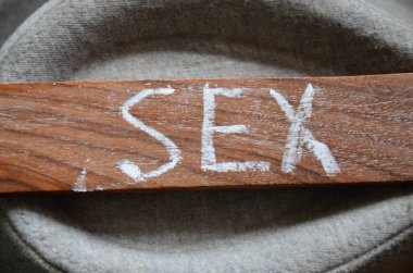 a wooden spoon with the word written on it.