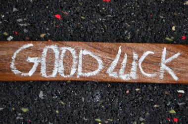 good luck written on a wooden block. happy luck