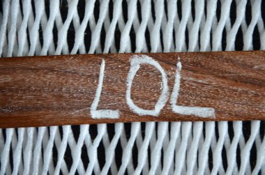 the word i 'm a ' written on a wooden surface