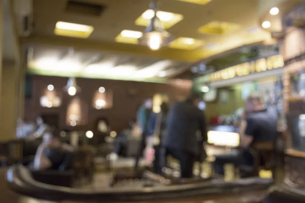 People in Coffee shop blur background with bokeh lights, vintage