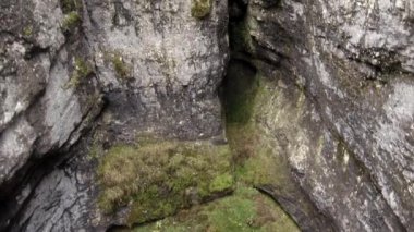 Sumgan-Kutuk karst cave. Descent cavers in the cave. Aerial view.
