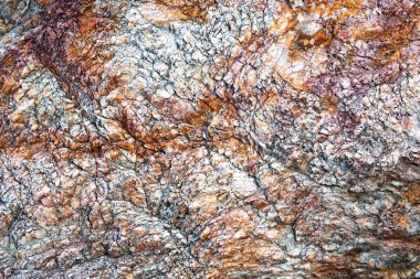 Arka plan için renkli desenli taş yüzeyi.