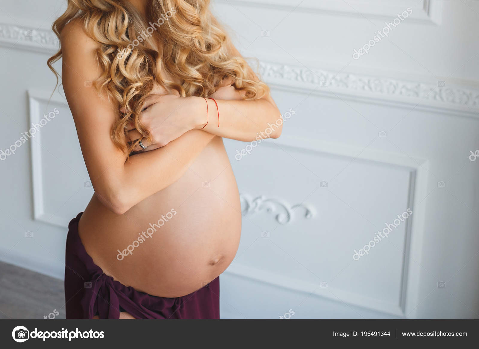 Long Hair Pregnant Nude - Pregnant with beautiful naked belly stands against white ...