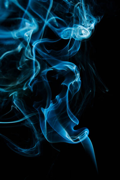 Abstract blue smoke isolated on black background from an Aromatic Sticks