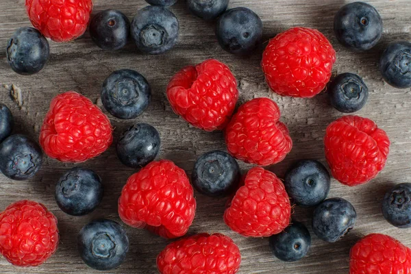 Table Top View Close Blueberries Raspberries Mix Spilled Gray Wood — Stock Photo, Image