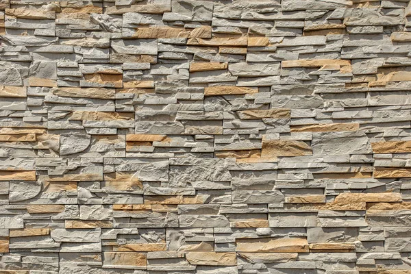 Rectangular stone wall tile texture.