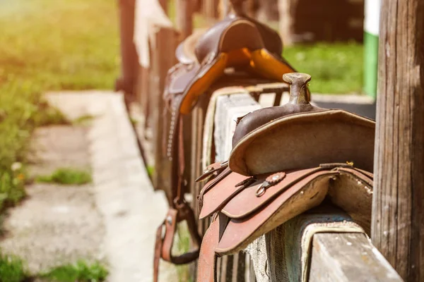 Old Horse Saddle Placed Wooden Fence Next House Lit Sun — Stock Photo, Image